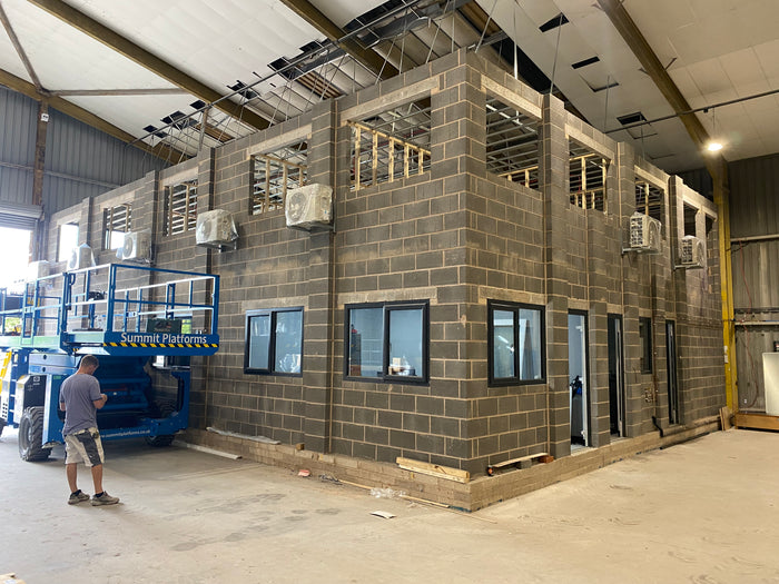 Commercial air conditioning installation with multiple outdoor units on a workspace building