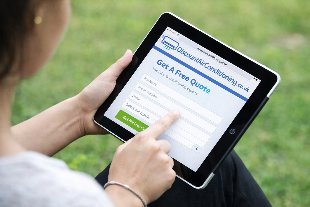Discount Air Conditioning instant online quote tool shown on a tablet